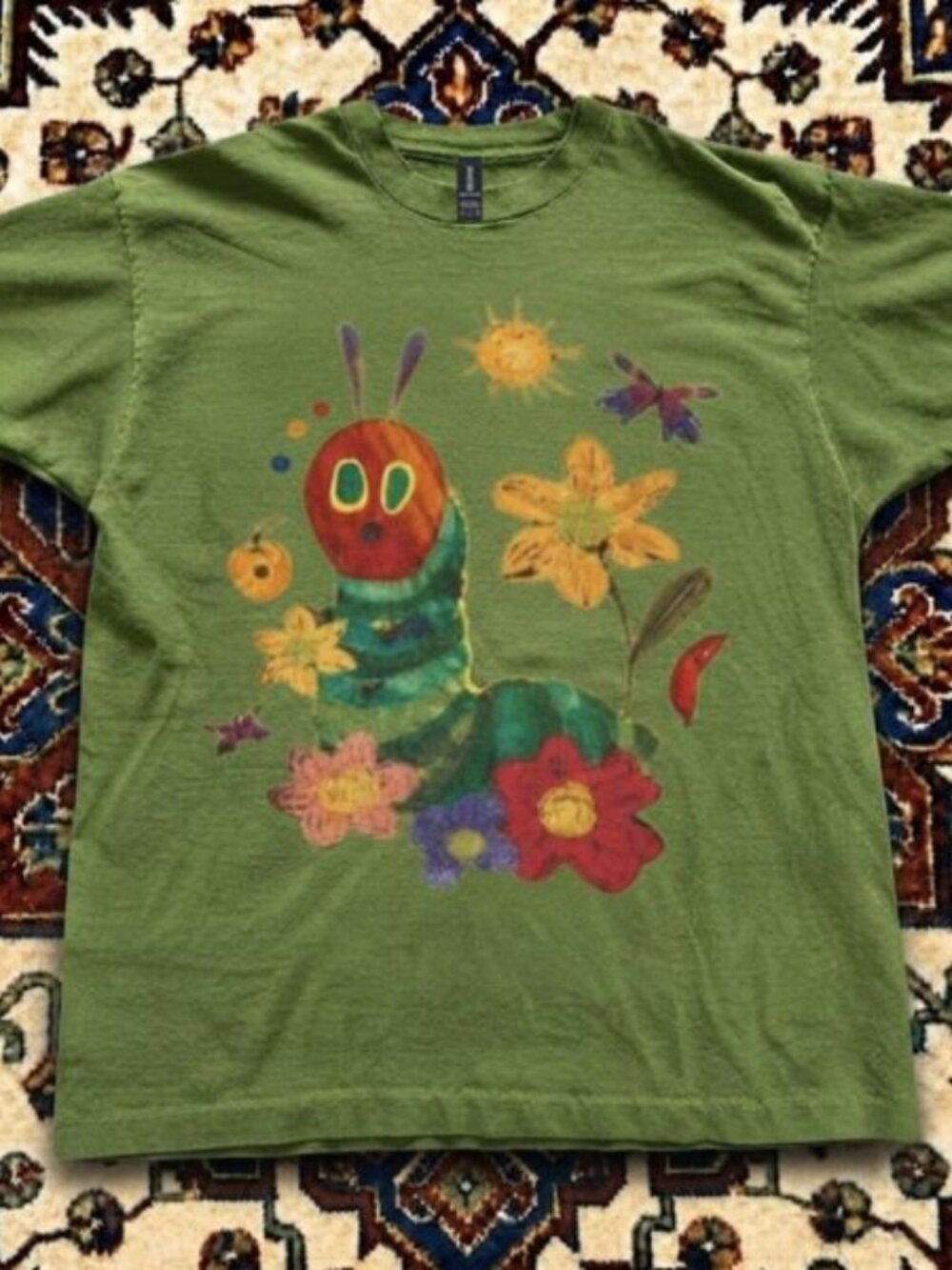 Green The Very Hungry Caterpillar tee with graphic of a caterpillar
